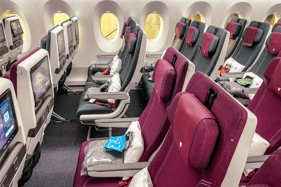 Qatar Airways burgundy and charcoal economy cabin on the Boeing 787