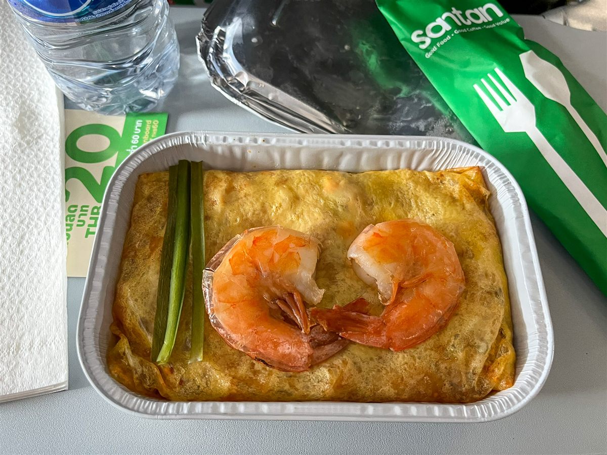 Santan in-flight shrimp omelet meal with water on an AirAsia tray